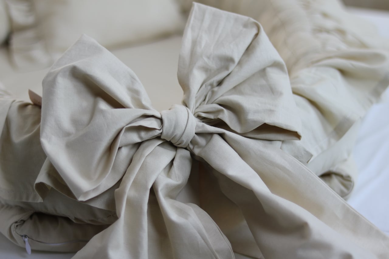 babynestchen schleife sand